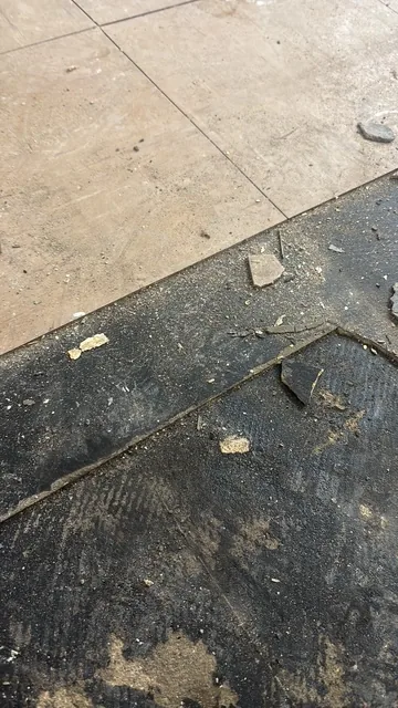 Black bitumen mastic floor removal in a NW6 flat